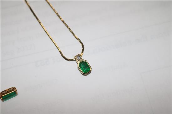 A gold, emerald and diamond pendant on a 14ct gold chain and a pair of similar gold, emerald and diamond ear studs.